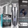 Επαναφορτιζόμενη κουρευτική μηχανή & trimmer με λεπίδα ακριβείας από ανοξείδωτο ατσάλι και εντυπωσιακό design. Με μεγάλη αυτονομία μπαταρίας, εργονομικό σχεδιασμό και αξεσουάρ, ιδανική για κάθε είδους περιποίηση σε μαλλιά, γένια και σώμα. Κατάλληλη για οικιακή και επαγγελματική χρήση. Χαρακτηριστικά: Ισχύς: 5W, Ταχύτητα 7000 RPM, Ψηφιακή οθόνη ένδειξης μπαταρίας LED, Λειτουργία χαμηλού θορύβου, Επαναφορτιζόμενη μπαταρία, Χρόνος φόρτισης: 2.5 ώρες, Χρόνος λειτουργίας: έως 240 λεπτά, 3 χτενάκια για διαφορετικά μήκη κοπής (1/2/3mm). Η συσκευασία περιλαμβάνει: 1 x Κουρευτική μηχανή, 1 x Καλώδιο φόρτισης, 3 x Χτενάκια οδηγοί, 1 x Βούρτσα καθαρισμού, 1 x Λαδάκι λίπανσης, 1 x Οδηγίες χρήσης στα Αγγλικά.
